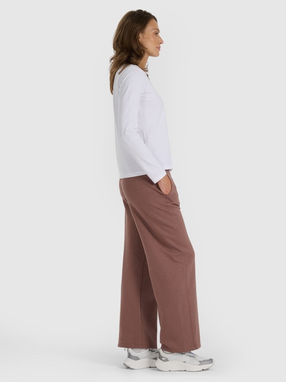 Damskie spodnie dresowe z szerokimi nogawkami 4F 4FRAW25TTROF1614 - brązowe