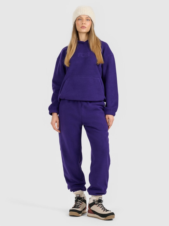 Damskie spodnie dresowe joggery polarowe 4F 4FRAW25TTROF1707 - fioletowe