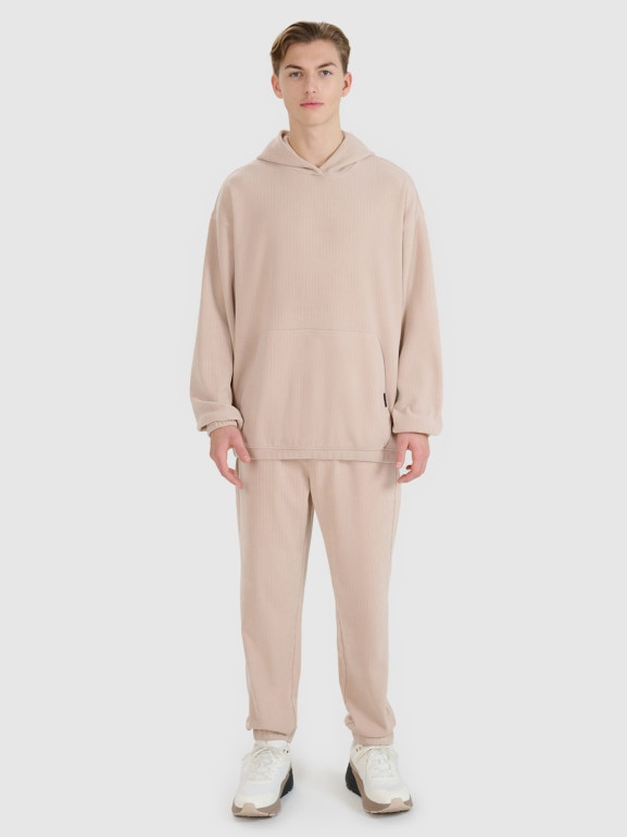 Męskie spodnie dresowe joggery 4F 4FRSS25TTROM1476 - beżowe