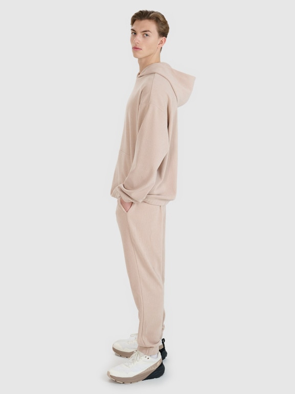 Męskie spodnie dresowe joggery 4F 4FRSS25TTROM1476 - beżowe