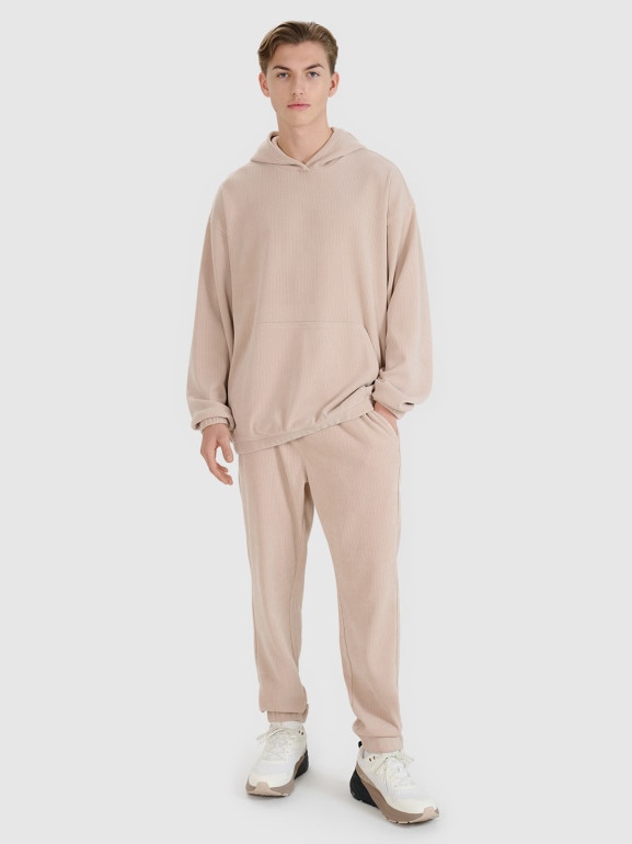 Męskie spodnie dresowe joggery 4F 4FRSS25TTROM1476 - beżowe