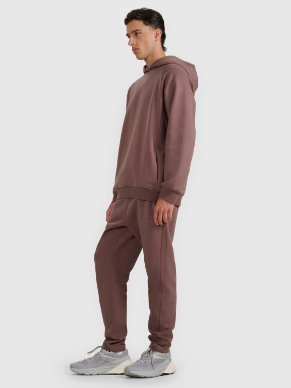 Męskie spodnie dresowe 4F 4FWAW25TTROM1251 - brązowe