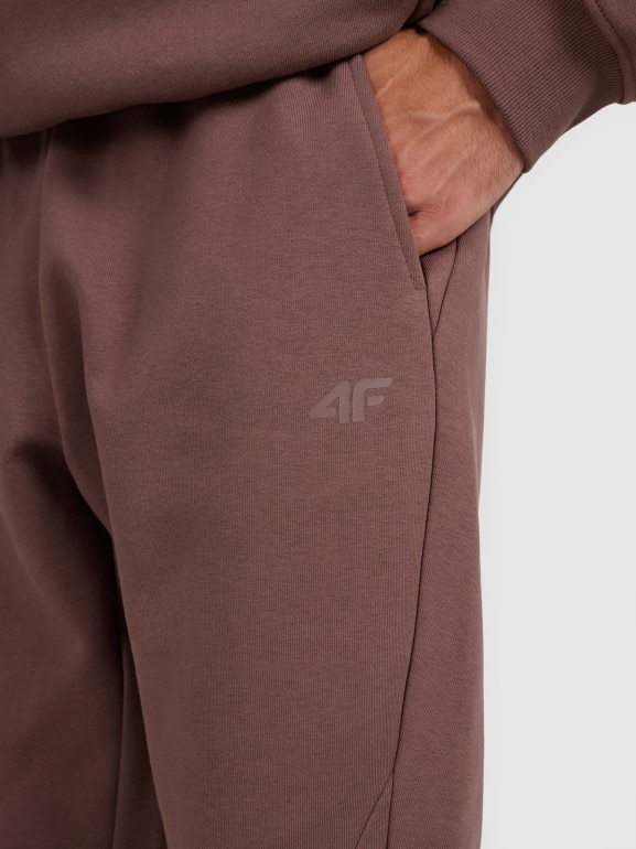 Męskie spodnie dresowe 4F 4FWAW25TTROM1251 - brązowe