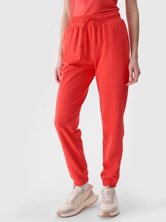 Damskie spodnie dresowe joggery 4F 4FWMM00TTROF1138 - czerwone