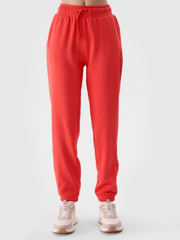 Damskie spodnie dresowe joggery 4F 4FWMM00TTROF1138 - czerwone