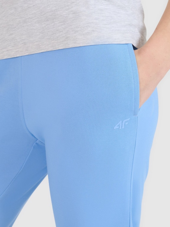Damskie spodnie dresowe joggery 4F 4FWMM00TTROF1386 - niebieskie