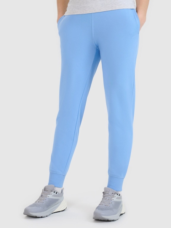 Damskie spodnie dresowe joggery 4F 4FWMM00TTROF1386 - niebieskie