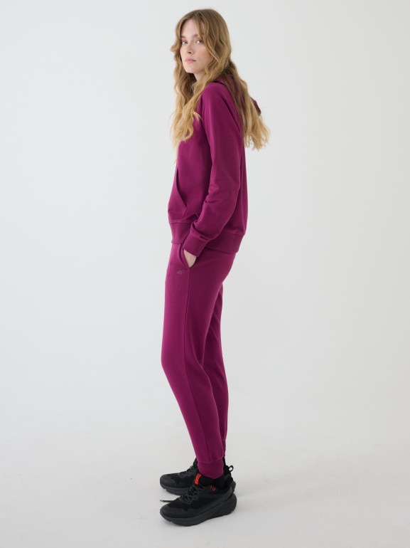 Damskie spodnie dresowe joggery 4F 4FWMM00TTROF1386 - fioletowe