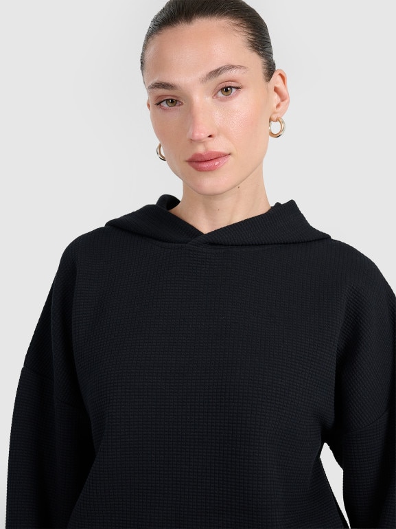 Damska bluza dresowa nierozpinana z kapturem 4F 4FWAW25TSWSF1847 - czarna