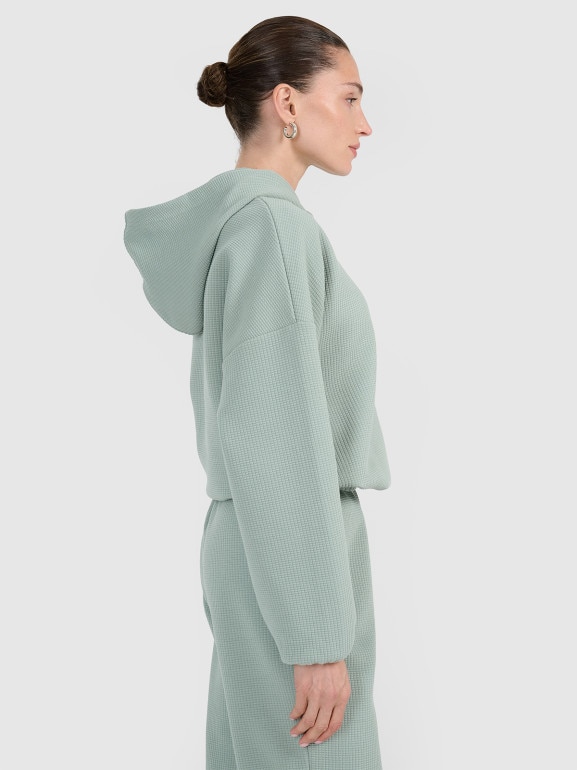 Damska bluza dresowa nierozpinana z kapturem 4F 4FWAW25TSWSF1847 - zielona