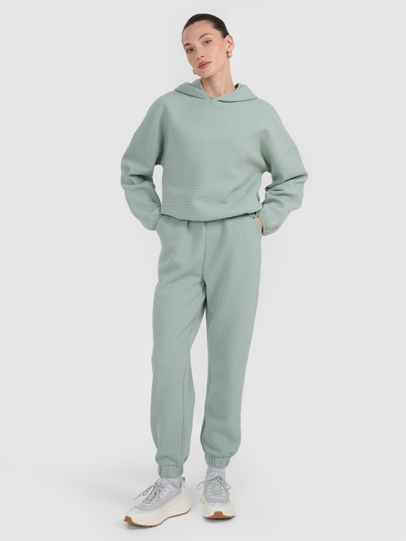 Damska bluza dresowa nierozpinana z kapturem 4F 4FWAW25TSWSF1847 - zielona