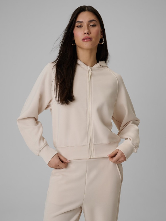 Damska bluza dresowa rozpinana z kapturem 4F 4FWSS26TSWSF2178 - kremowa