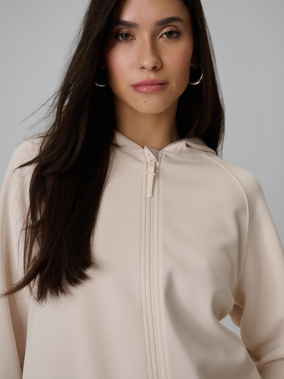 Damska bluza dresowa rozpinana z kapturem 4F 4FWSS26TSWSF2178 - kremowa