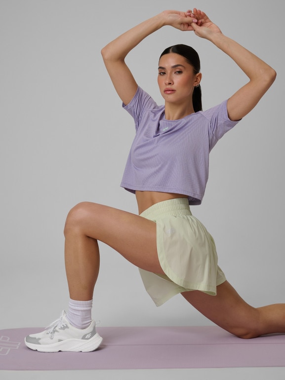 Damski crop top treningowy 4F 4FWSS26TFTSF1806 - fioletowy