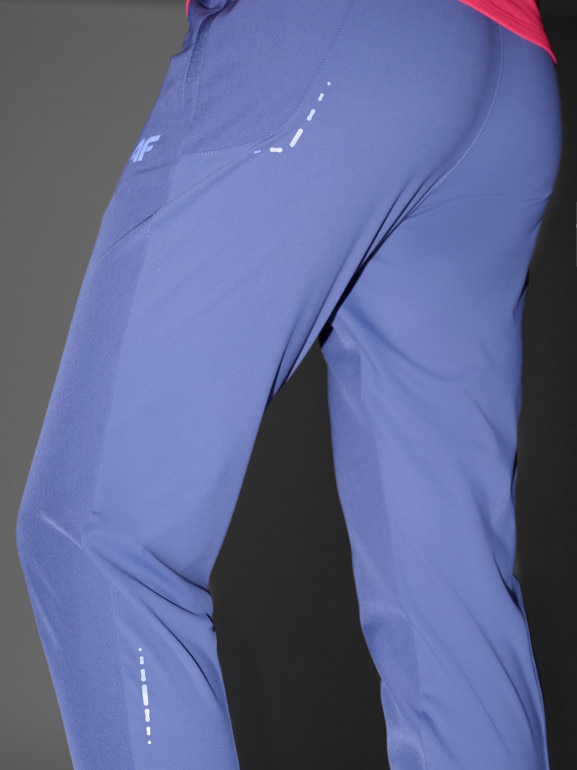 Damskie spodnie do biegania w terenie 4F 4FWAW25TFTRF0931 - niebieskie