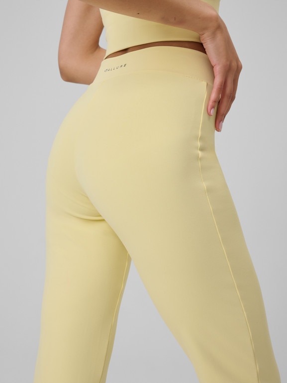 Damskie spodnie do jogi 4F 4FRSS26TFTRF1391 - żółte