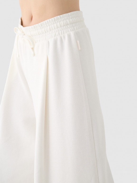 Damskie spodnie dresowe 4F 4FRSS24TTROF1331 - białe