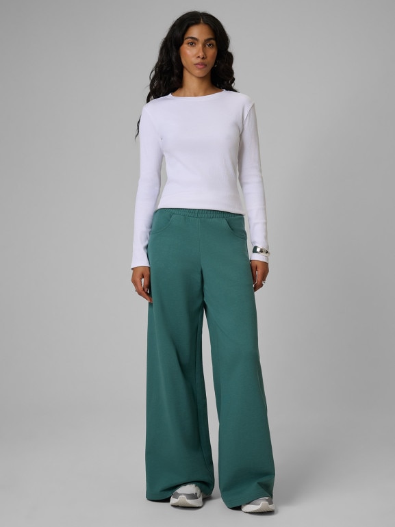 Damskie spodnie dresowe 4F 4FRSS26TTROF2011 - turkusowe