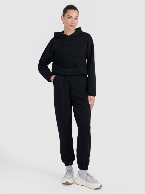 Damskie spodnie dresowe 4F 4FWAW25TTROF1184 - czarne