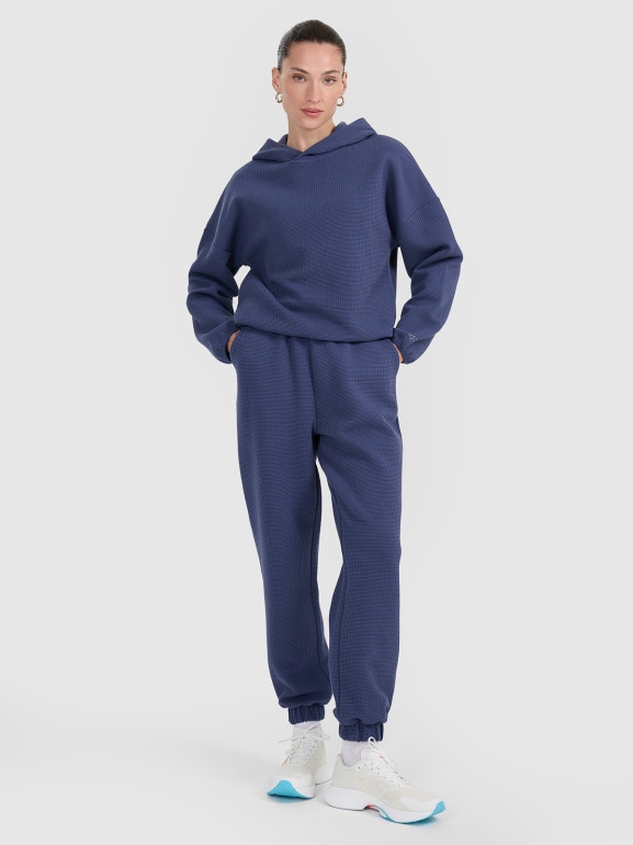 Damskie spodnie dresowe 4F 4FWAW25TTROF1184 - niebieskie