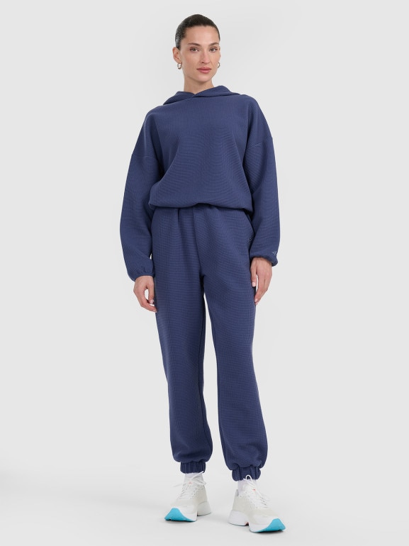 Damskie spodnie dresowe 4F 4FWAW25TTROF1184 - niebieskie