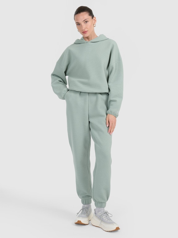 Damskie spodnie dresowe 4F 4FWAW25TTROF1184 - zielone