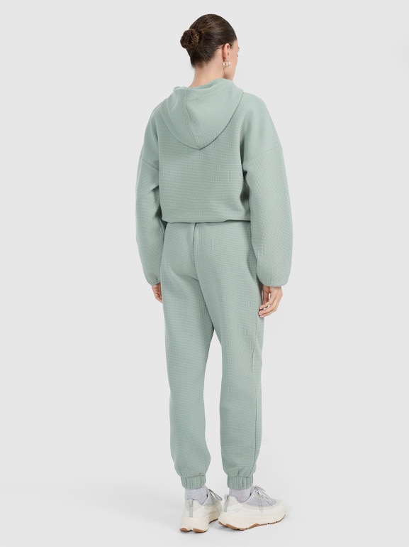 Damskie spodnie dresowe 4F 4FWAW25TTROF1184 - zielone