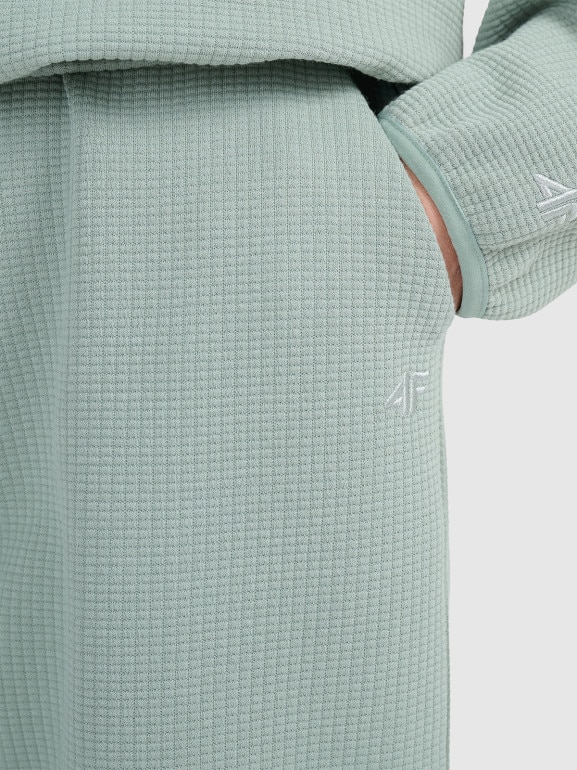 Damskie spodnie dresowe 4F 4FWAW25TTROF1184 - zielone