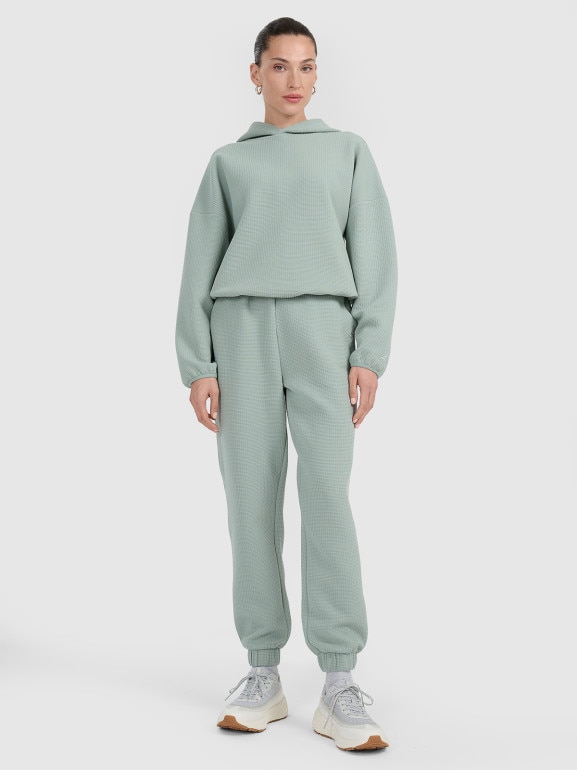 Damskie spodnie dresowe 4F 4FWAW25TTROF1184 - zielone