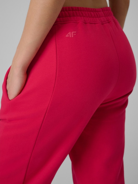 Damskie spodnie dresowe joggery 4F 4FRSS26TTROF1724 - czerwone