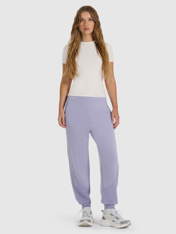 Damskie spodnie dresowe joggery 4F 4FWAW25TTROF1180 - fioletowe