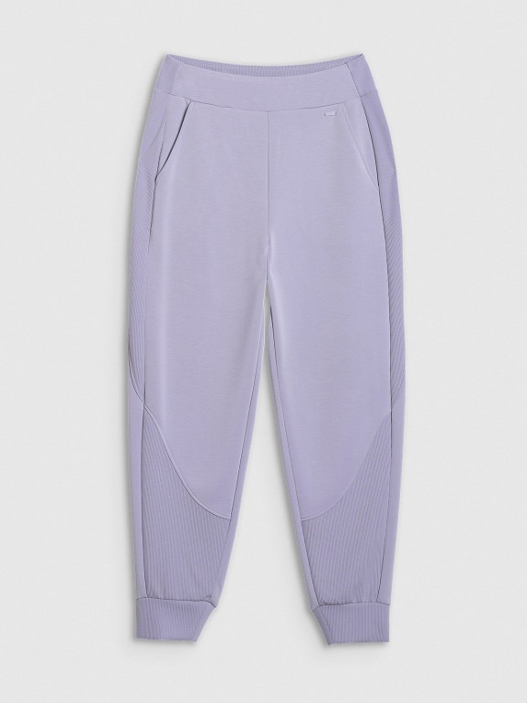 Damskie spodnie dresowe joggery 4F 4FWAW25TTROF1180 - fioletowe