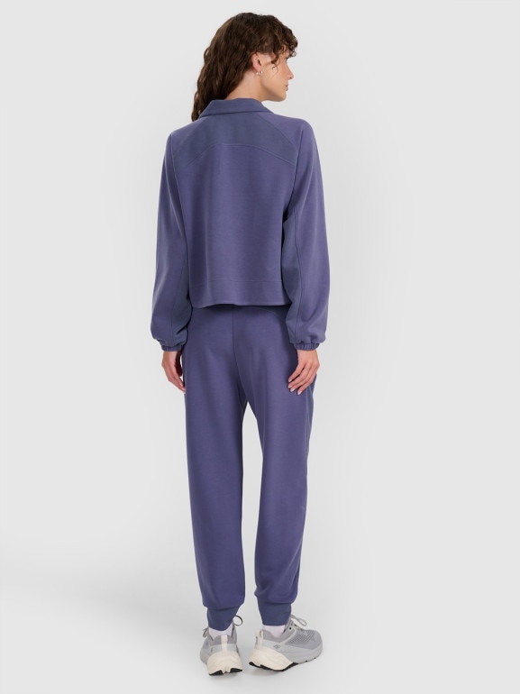 Damskie spodnie dresowe joggery 4F 4FWAW25TTROF1180 - niebieskie