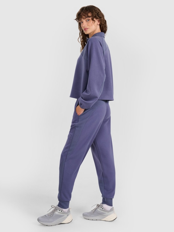 Damskie spodnie dresowe joggery 4F 4FWAW25TTROF1180 - niebieskie