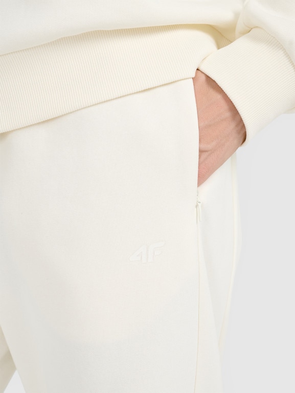 Damskie spodnie dresowe joggery 4F 4FWAW25TTROF1185 - białe