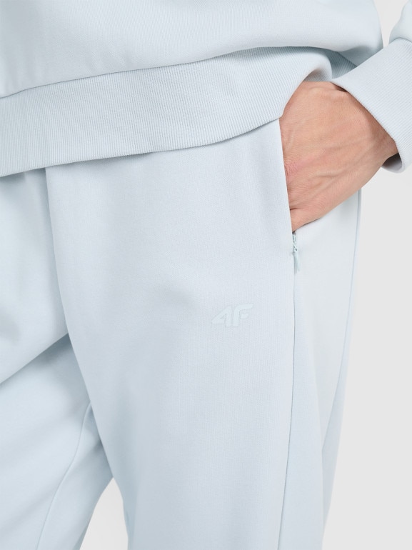 Damskie spodnie dresowe joggery 4F 4FWAW25TTROF1185 - niebieskie