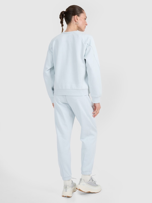 Damskie spodnie dresowe joggery 4F 4FWAW25TTROF1185 - niebieskie