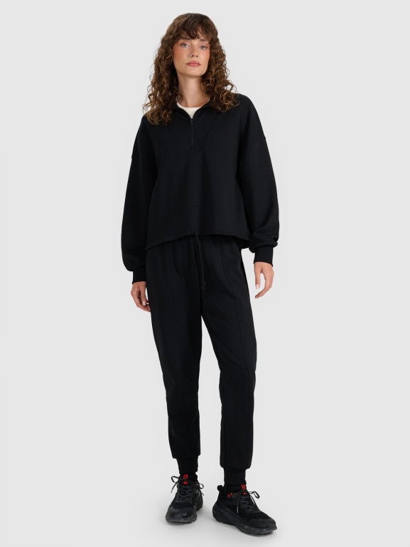 Damskie spodnie dresowe joggery 4F 4FWAW25TTROF1196 - czarne