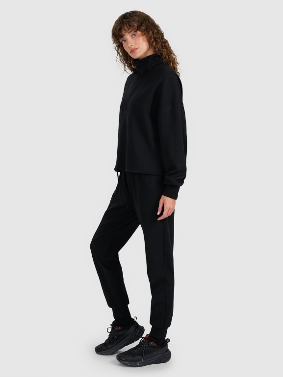 Damskie spodnie dresowe joggery 4F 4FWAW25TTROF1196 - czarne