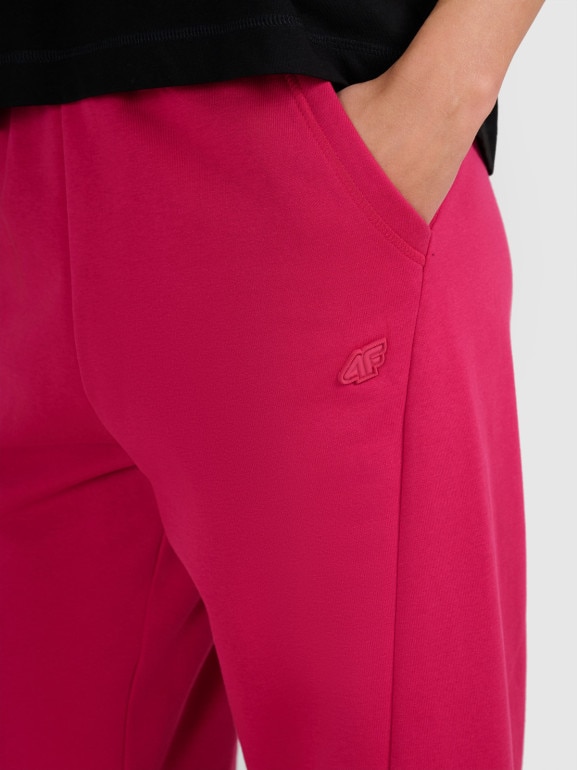 Damskie spodnie dresowe joggery 4F 4FWAW25TTROF1205 - różowe