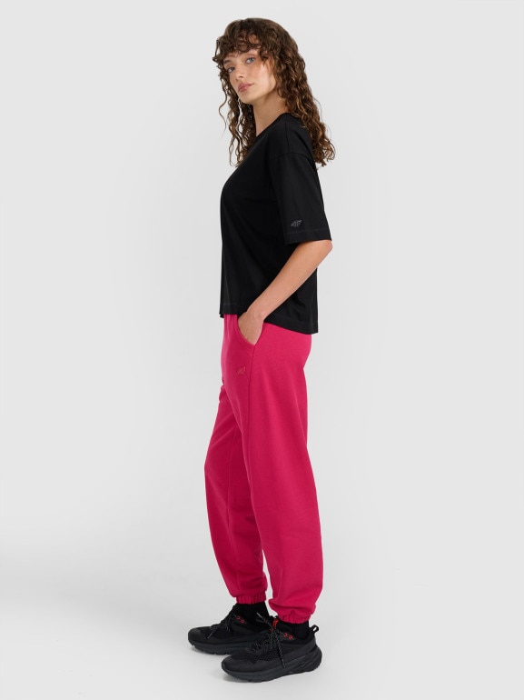 Damskie spodnie dresowe joggery 4F 4FWAW25TTROF1205 - różowe