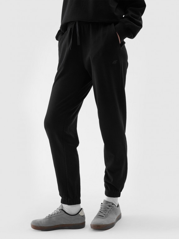 Damskie spodnie dresowe joggery 4F 4FWMM00TTROF1138 - czarne 