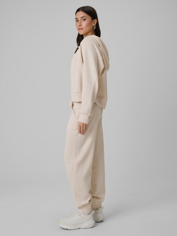 Damskie spodnie dresowe joggery 4F 4FWSS26TTROF1410 - beżowe