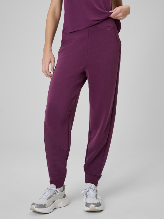 Damskie spodnie dresowe joggery 4F 4FWSS26TTROF1410 - fioletowe
