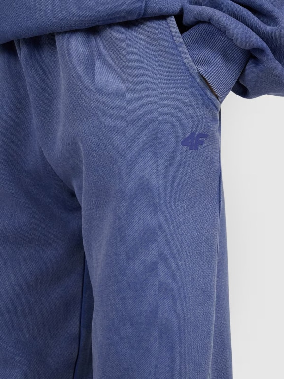 Dziewczęce spodnie dresowe joggery 4F 4FJRAW25TTROF1473 - niebieskie