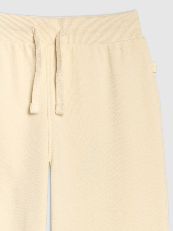 Dziewczęce spodnie dresowe 4F 4FJRAW25TTROF1600 - beżowe