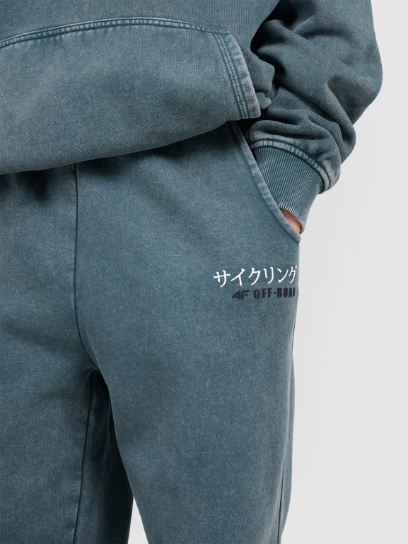 Chłopięce spodnie dresowe joggery 4F 4FJRAW25TTROM1528 - turkusowe