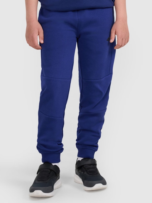 Chłopięce spodnie dresowe joggery 4F 4FJRAW25TTROM1578 - granatowe