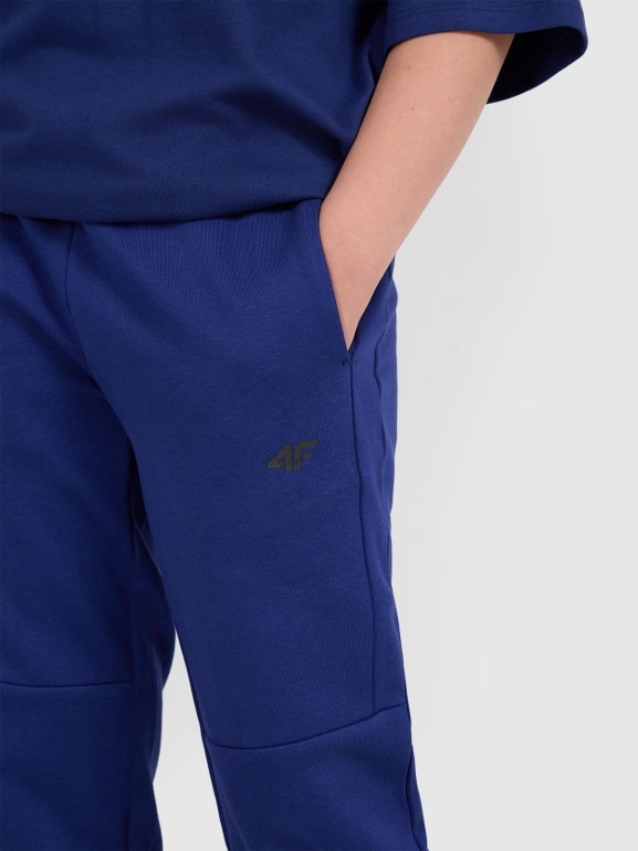 Chłopięce spodnie dresowe joggery 4F 4FJRAW25TTROM1578 - granatowe