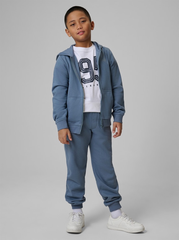 Chłopięce spodnie dresowe joggery 4F 4FJRSS26TTROM1824 - denim